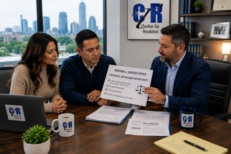 Tax professional reviewing IRS penalty refund options with clients related to the Kwong v. United States case
